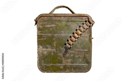Old metal ammo box with empty machine gun belt isolated on white background. photo