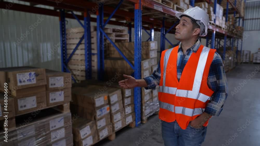 Business concept of 4k Resolution. The manager is explaining the process of working in the warehouse. Business concept of 4k Resolution. The manager is explaining the process of working in the warehouse.