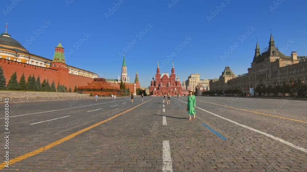 An attractive tourist walking along the Red Square An attractive tourist walking along the Red Square