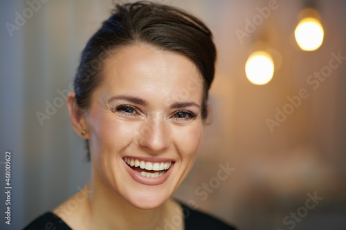 Portrait of smiling female worker in modern beauty salon