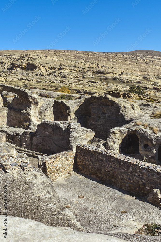 The Uplistsikhe cave complex near Gori, Georgia. Ancient rock-hewn town and three-nave basilica in eastern Georgia. Georgian gourist landmark The Uplistsikhe cave complex near Gori, Georgia. Ancient rock-hewn town and three-nave basilica in eastern Georgia. Georgian gourist landmark