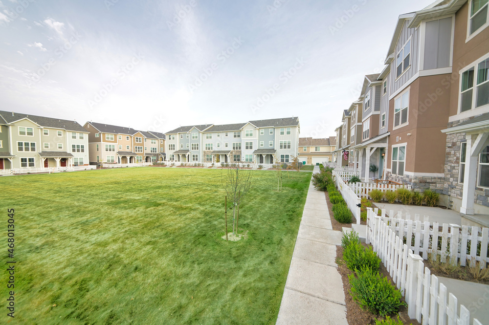 Large lawn field in the middle of townhouse buildings Large lawn field in the middle of townhouse buildings