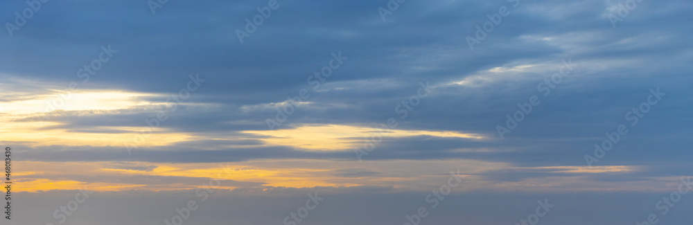 Dark sky with blue clouds at sunset Dark sky with blue clouds at sunset