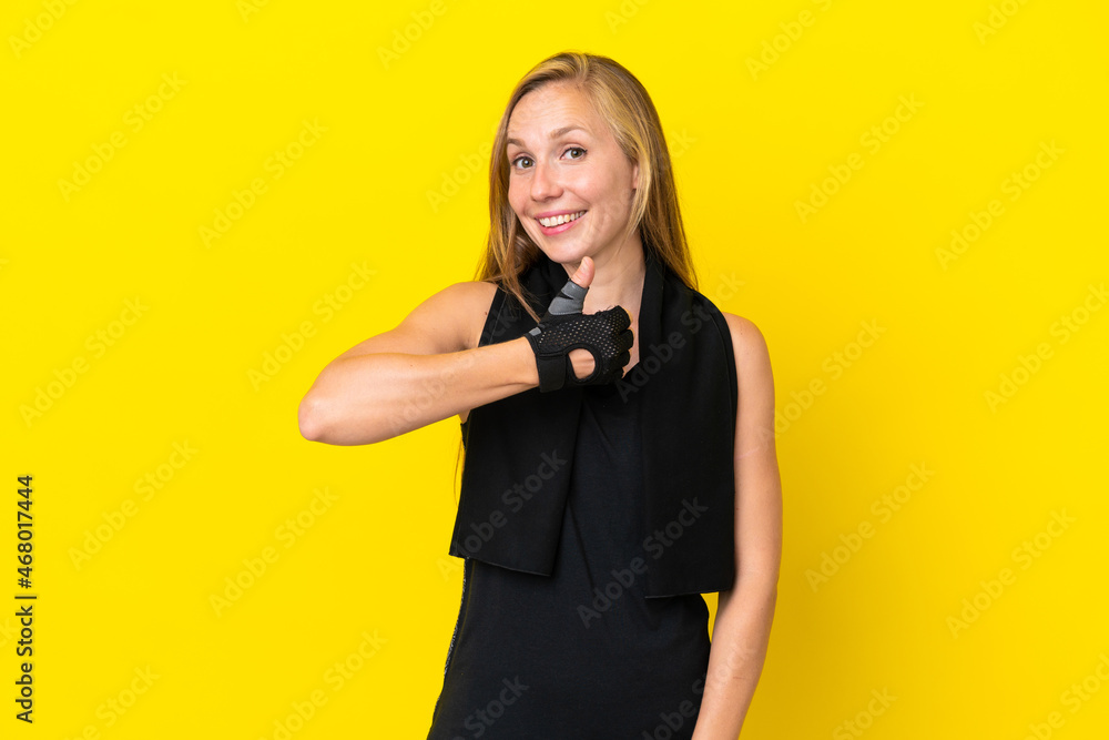 Young sport English woman isolated on white background giving a thumbs up gesture Young sport English woman isolated on white background giving a thumbs up gesture