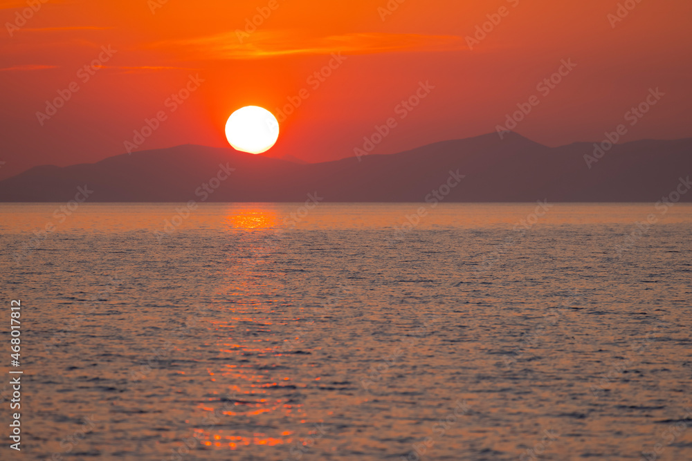romantic sunrise over the greece island