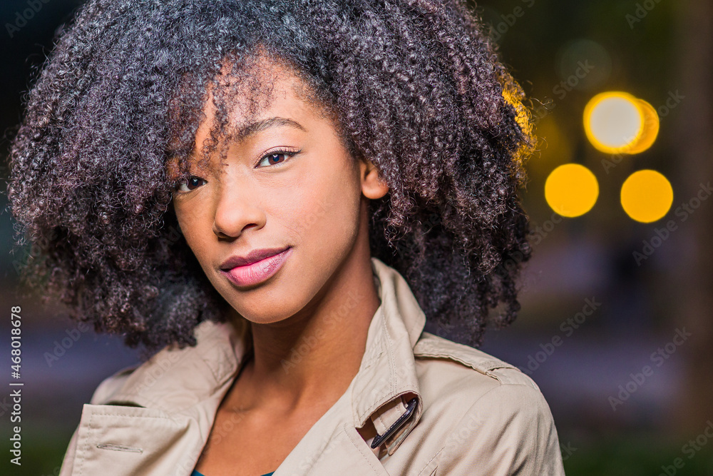 Dominican Republic young student woman headshot. Winter lifestyle afro hair Latin portrait Dominican Republic young student woman headshot. Winter lifestyle afro hair Latin portrait