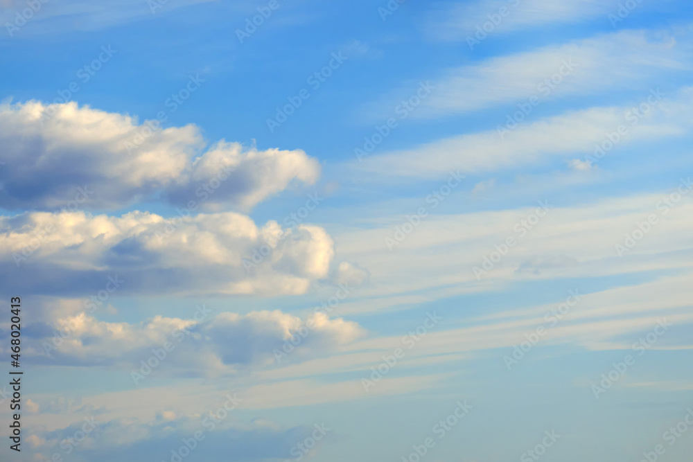 Blue sky background with white soft clouds