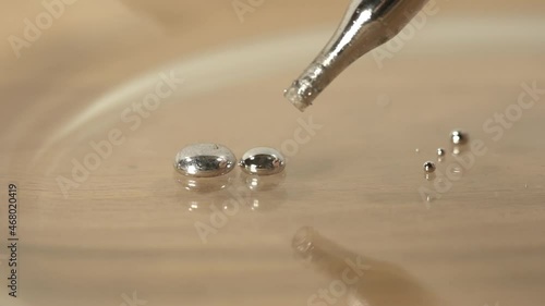 close up of drops of mercury the liquid metal