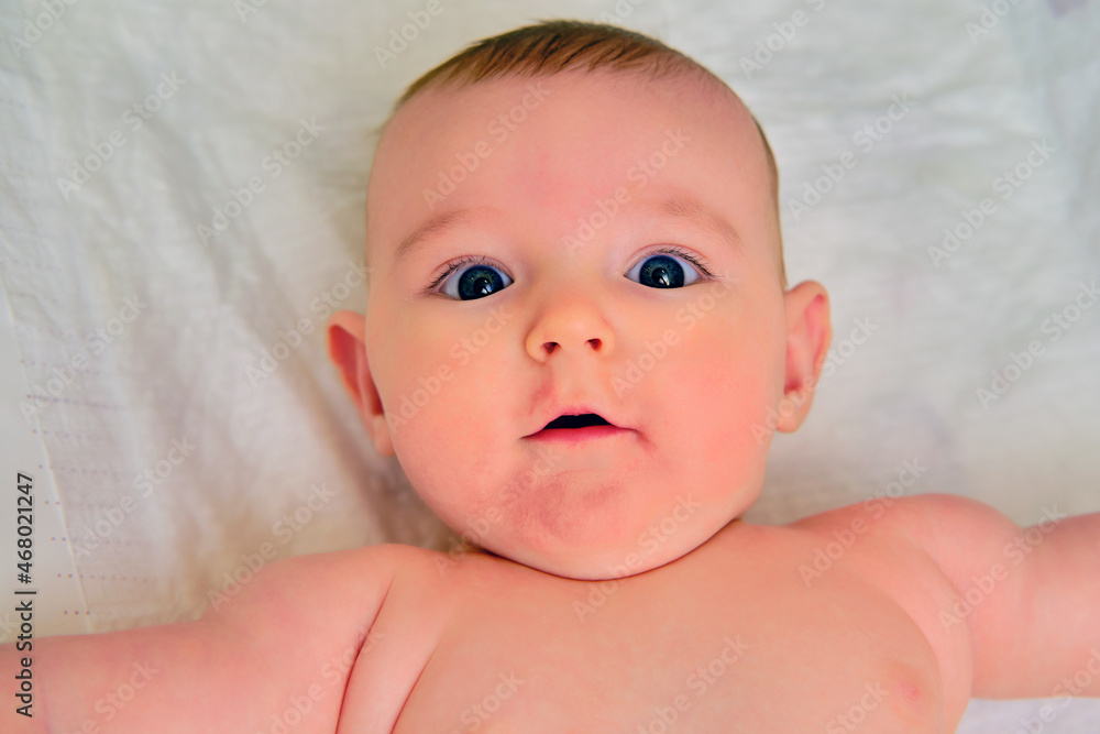Portrait of a happy surprised child, selfie photo of an infant baby Portrait of a happy surprised child, selfie photo of an infant baby
