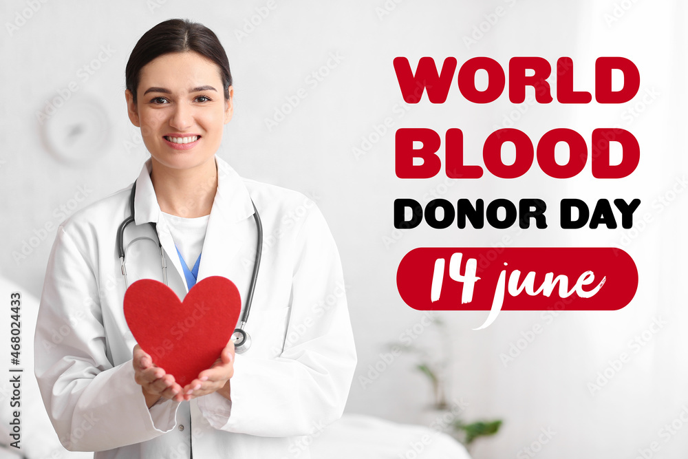 Female doctor with red heart in clinic. World Blood Donor Day Female doctor with red heart in clinic. World Blood Donor Day