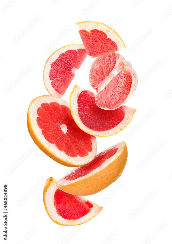 Falling cut grapefruit on white background Falling cut grapefruit on white background
