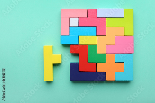 Multicolored puzzle and cubes on a blue background