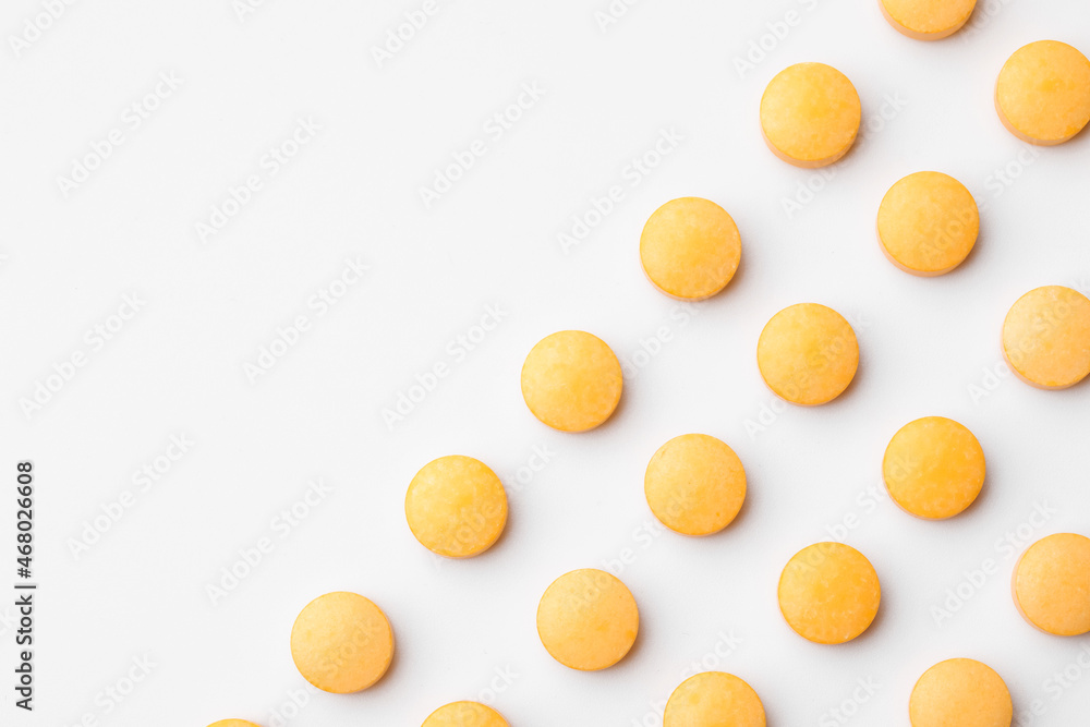 Many vitamin A pills on white background, closeup Many vitamin A pills on white background, closeup