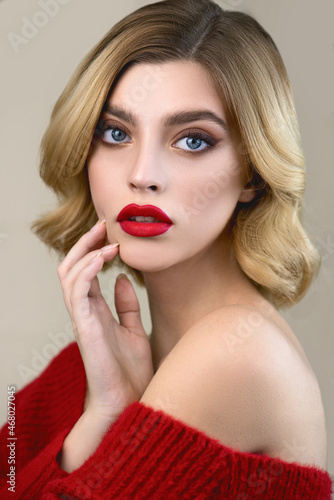 Beautiful young woman with perfect young skin and professional makeup with red lips. Skincare seasonal beauty concept.
