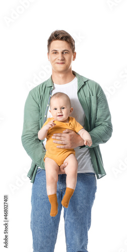 Young father holding little...