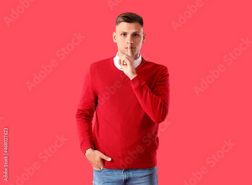 Young man showing silence g...