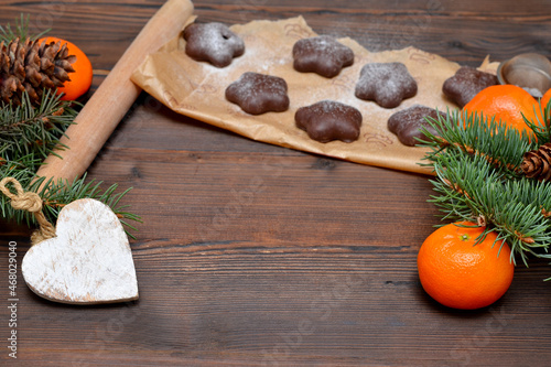 tangerines and chocolate chip cookies for Christmas on wooden background, place for object,