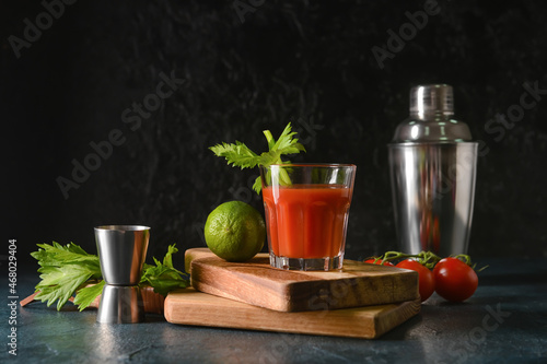 Boards with glass of bloody mary on table © Pixel-Shot