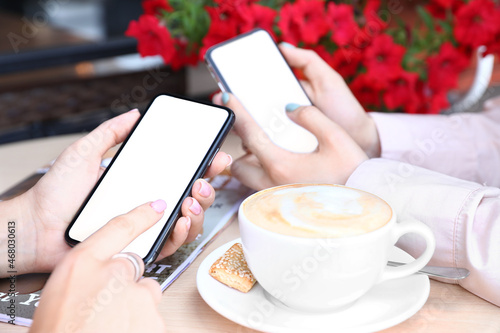 Women using mobile phones i...