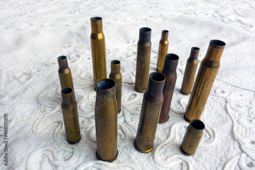 Empty cartridges of various calibers, after shooting, on the wor