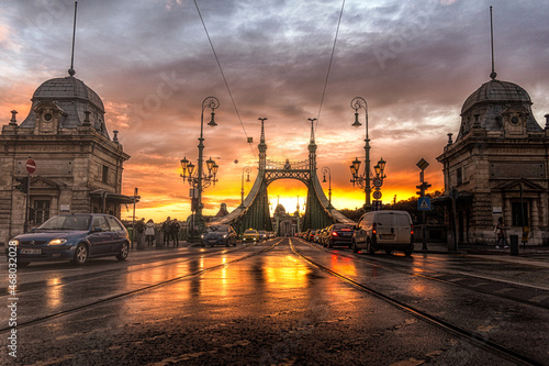 Photography A beautiful surreal sunset light on Liberty Bridge, Budapest after rain