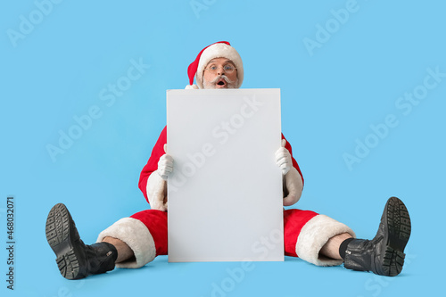 Santa Claus with blank post...