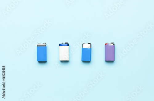 Alkaline batteries in row on blue background