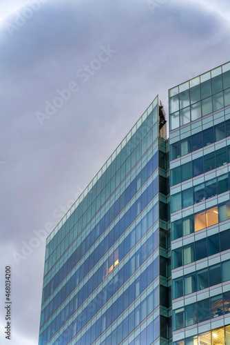 Large building exterior with blue tinted glass curtain walls at Salt Lake City, Utah