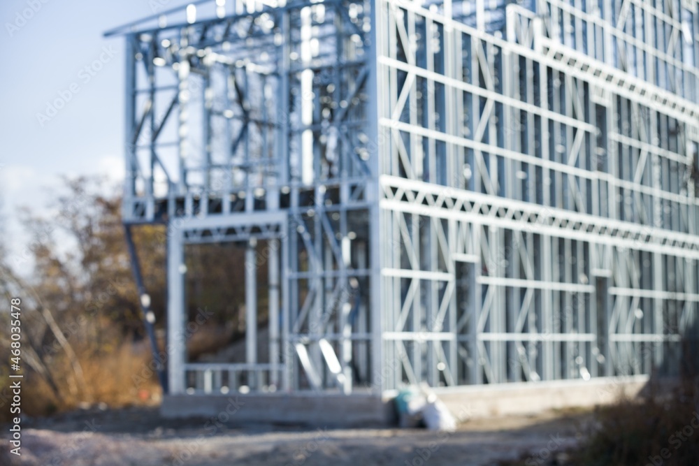 Metal frame of the building with a sandwich panel of insulation on the wall Metal frame of the building with a sandwich panel of insulation on the wall