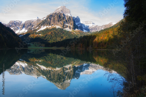 Snowcapped mountain reflections in Obersee, Nafels, Glarus, Switzerland photo