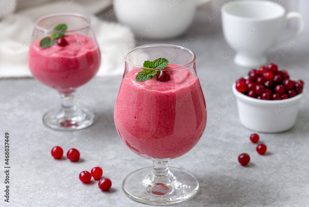 custom made wallpaper toronto digitalTwo glasses of cranberry smoothie with fresh cranberries in a bowl. Selective focus, gray concrete background