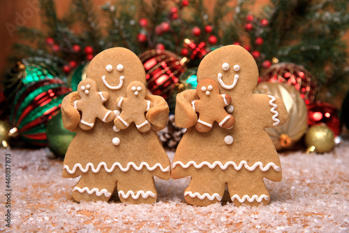 Family of Gingerbreads with 3 kids on Holiday Christmas Background