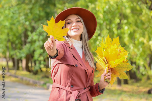Happy woman with autumn bou...