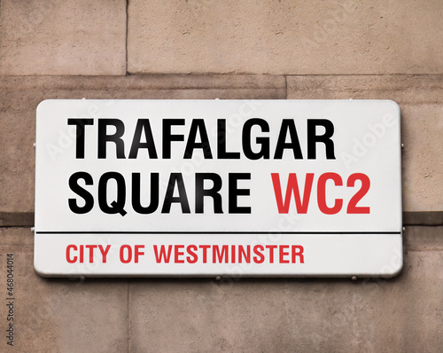 Sign indicating to the public they are in Trafalgar Square, best known for Nelson's Column, a huge monument towering the area at 169 feet and 3 inches, it's a tourist favorite and cultural hotspot.