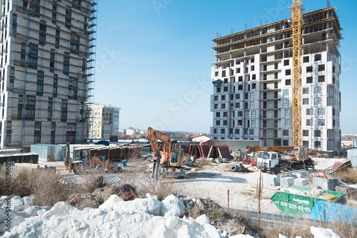 The architectural complex of residential buildings on sky background