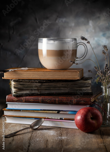Chaka coffee latte on a stack of old books photo
