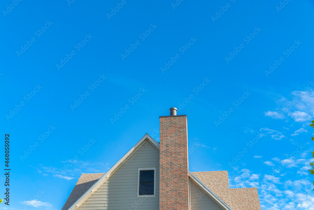 Two-tone bricks on a chimney post outside a house at Daybreak, Utah