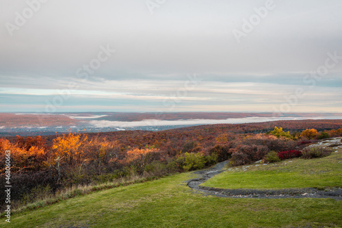 High Point State Park, NJ, overlooking tri-states with Matamoras, PA, and Port Jervis, NY, as fog rises over Delaware River on a late fall morning