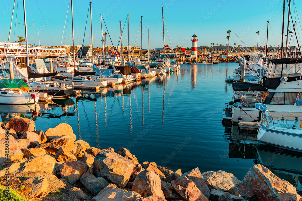 Oceanside Harbor with lighthouse and filled with boats.
