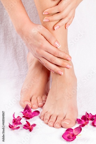 Female Feet and Petals  concept of Beauty Spa
