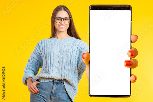 Phone in woman hand. Big ph...
