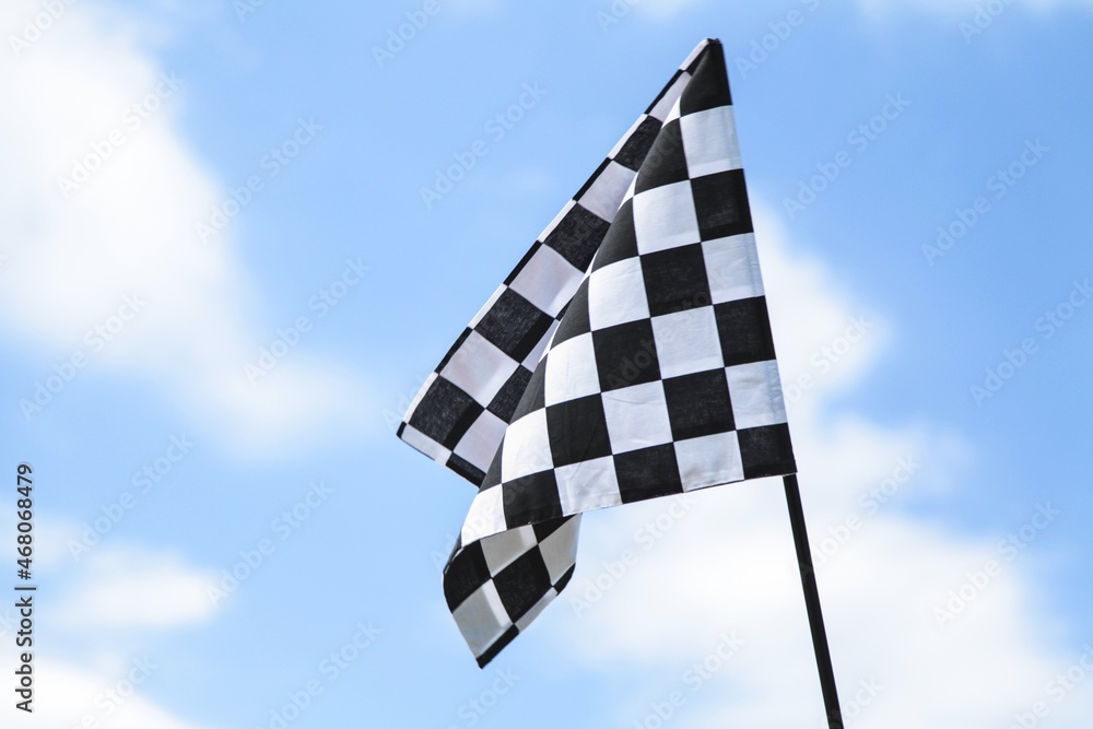 Racing Flag On Sky Background