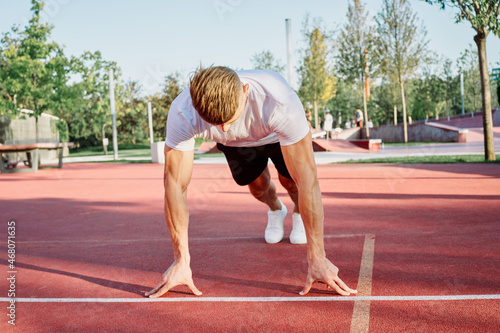 man doing exercises outdoors on the playground