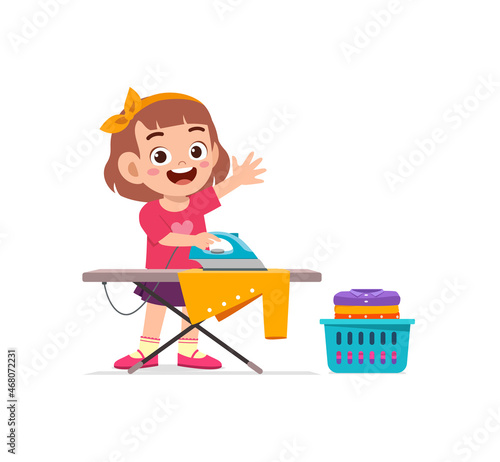 little girl use electric iron to smooth clothes