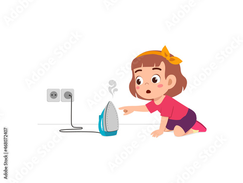 little girl curious to touch hot electric iron