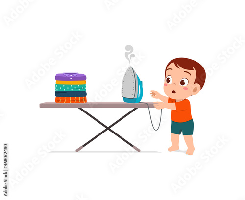 little baby curious to touch hot electric iron