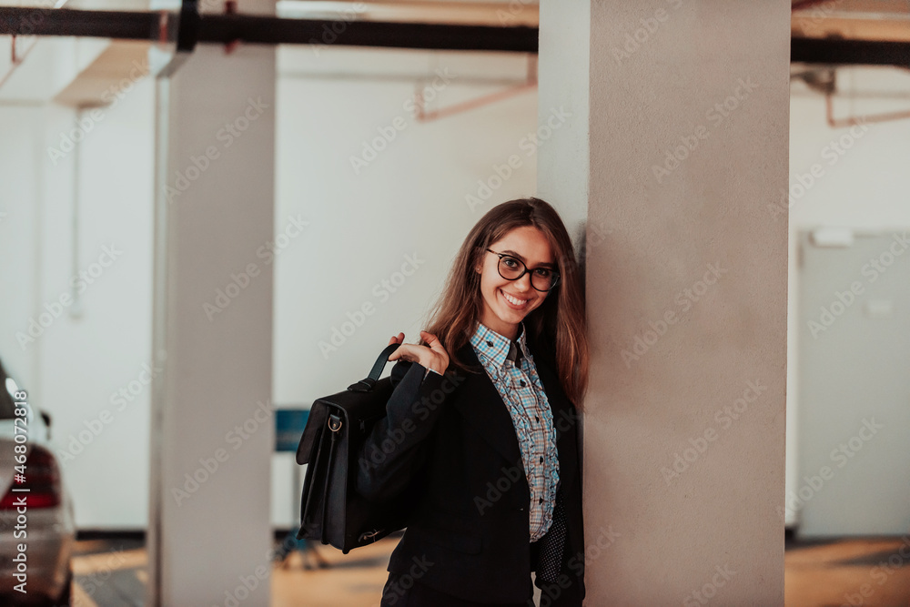 A business woman in a suit with a briefcase in her hand goes to work. Selective focus. Business concept A business woman in a suit with a briefcase in her hand goes to work. Selective focus. Business concept