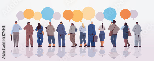mix race businesspeople team standing back to camera rear view of business people group chat bubble communication