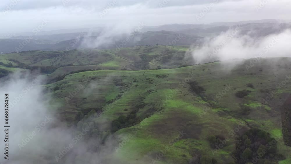 Low clouds drift across the rolling hills found east of San Francisco Bay, California. This region, dry much of the year, turns green during the winter months due to much needed rain. Low clouds drift across the rolling hills found east of San Francisco Bay, California. This region, dry much of the year, turns green during the winter months due to much needed rain.