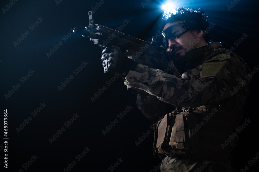 A strong man who could be used as an image for a mercenary or survival game in military clothing. A strong man who could be used as an image for a mercenary or survival game in military clothing.